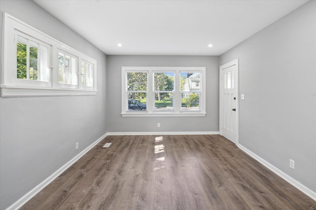 3410 Russell Ave N, Minneapolis, MN 55412 - unfurnished living room featuring plenty of natural light, wood finished floors, baseboards, and recessed lighting