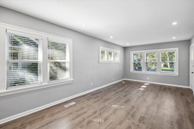 3410 Russell Ave N, Minneapolis, MN 55412 - spare room with baseboards, wood finished floors, and recessed lighting