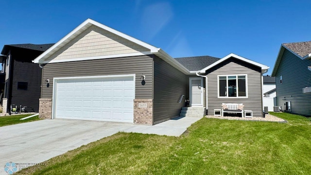 5477 11th St W, West Fargo, ND 58078 - ranch-style house featuring driveway, brick siding, a front lawn, and a garage
