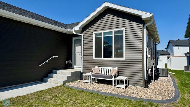 5477 11th St W, West Fargo, ND 58078 - exterior space with central AC and a lawn