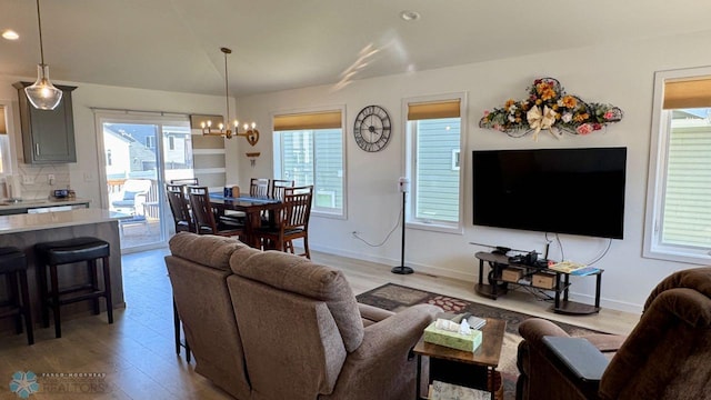 5477 11th St W, West Fargo, ND 58078 - living room featuring baseboards, recessed lighting, a chandelier, and light wood-type flooring