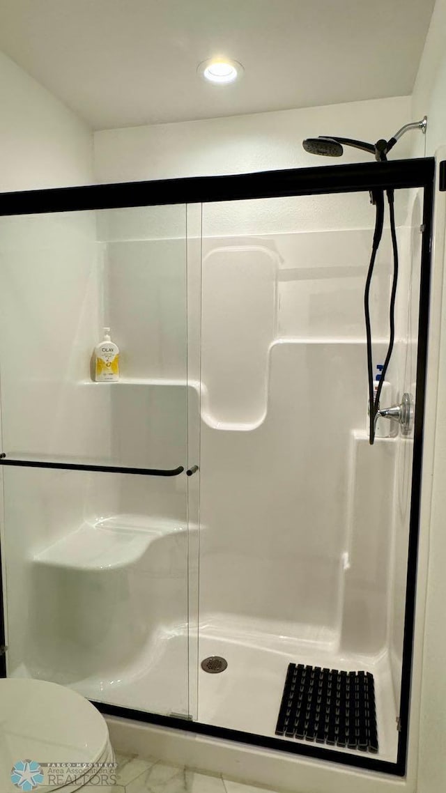 5477 11th St W, West Fargo, ND 58078 - full bathroom with toilet, marble finish floor, a stall shower, and recessed lighting