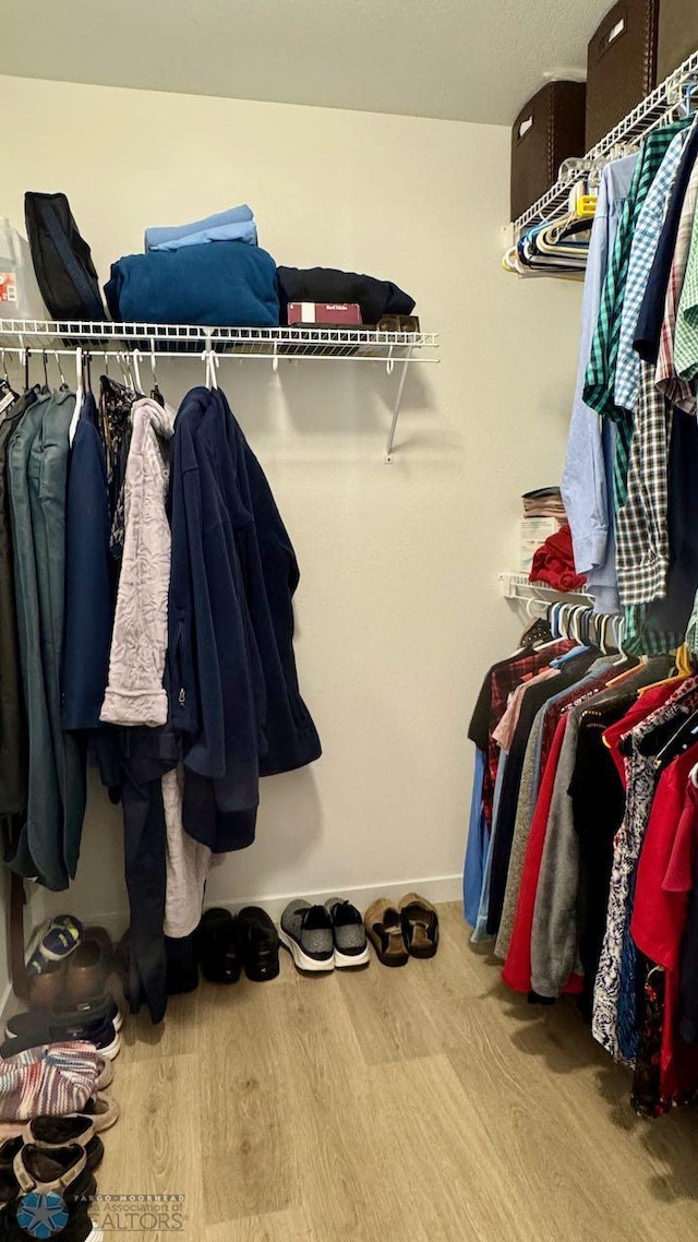 5477 11th St W, West Fargo, ND 58078 - walk in closet featuring wood finished floors