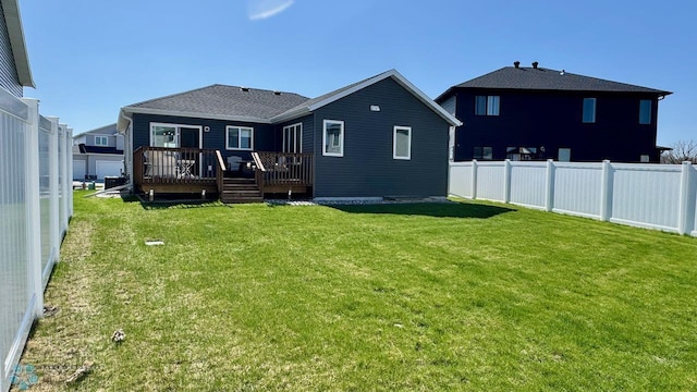 5477 11th St W, West Fargo, ND 58078 - rear view of house featuring a deck, a lawn, and a fenced backyard