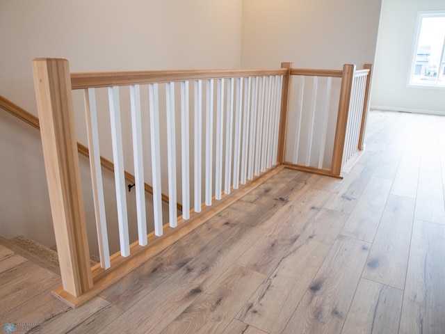 stairs with wood finished floors