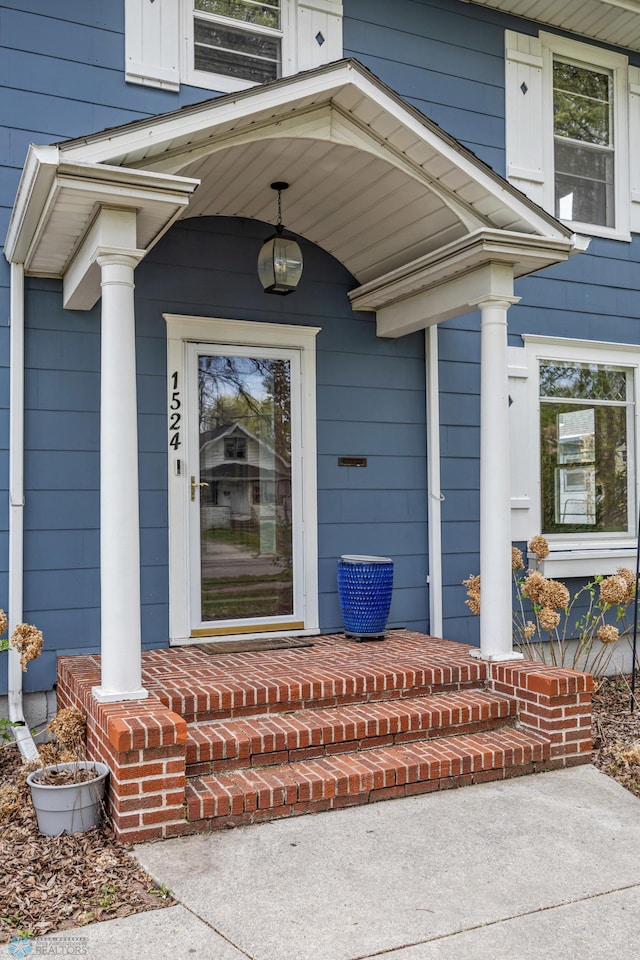 doorway to property with a porch