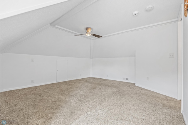 bonus room with lofted ceiling, carpet floors, and a ceiling fan