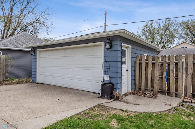 detached garage with fence