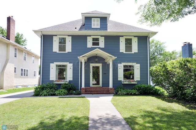 1524 5th Ave S, Fargo, ND 58103 - traditional style home featuring a front lawn and roof with shingles