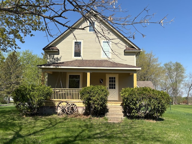 1105 13th St N, Benson, MN 56215 - view of front facade with covered porch, a front yard, and roof with shingles