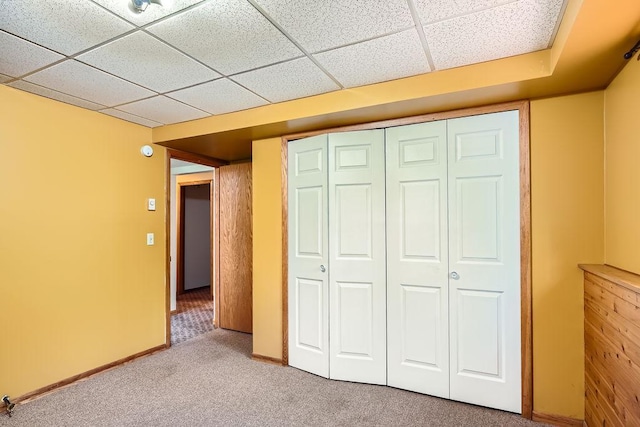 2108 Gunflint Trl, Brooklyn Park, MN 55444 - unfurnished bedroom featuring carpet floors, a closet, and a paneled ceiling