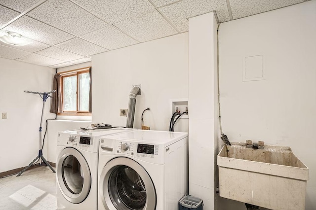 2108 Gunflint Trl, Brooklyn Park, MN 55444 - laundry area with washer and dryer and a sink