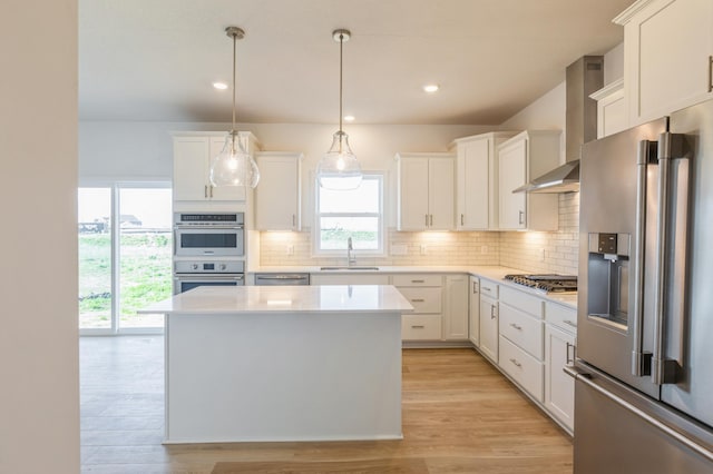 4424 Obsidian Way, Victoria, MN 55386 - kitchen with appliances with stainless steel finishes, a sink, wall chimney range hood, light countertops, and decorative backsplash