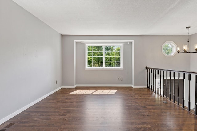1604 Viking Dr, Buffalo, MN 55313 - spare room with a chandelier, wood finished floors, and baseboards