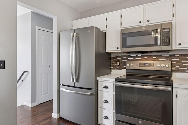 1604 Viking Dr, Buffalo, MN 55313 - kitchen featuring appliances with stainless steel finishes, dark wood-style floors, backsplash, light countertops, and white cabinets