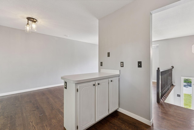 1604 Viking Dr, Buffalo, MN 55313 - washroom featuring dark wood-type flooring and baseboards