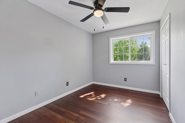1604 Viking Dr, Buffalo, MN 55313 - unfurnished bedroom featuring wood finished floors, baseboards, ceiling fan, and a closet