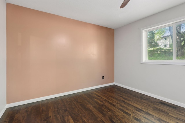 1604 Viking Dr, Buffalo, MN 55313 - spare room featuring dark wood finished floors, a ceiling fan, and baseboards