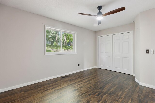 1604 Viking Dr, Buffalo, MN 55313 - unfurnished bedroom featuring dark wood finished floors, baseboards, a closet, and ceiling fan