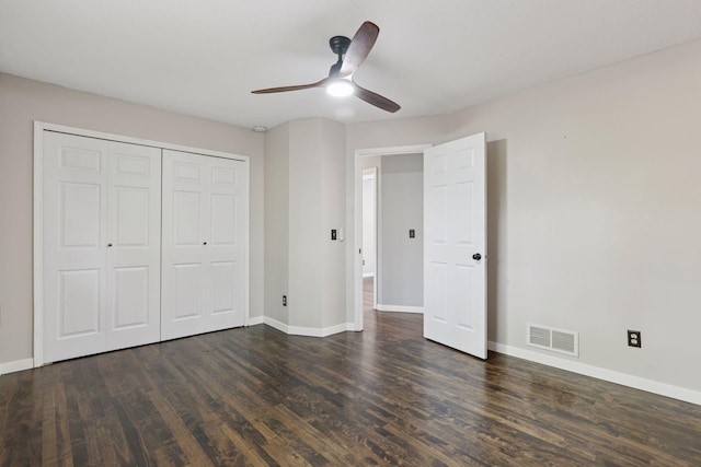 1604 Viking Dr, Buffalo, MN 55313 - unfurnished bedroom featuring dark wood-style floors, baseboards, a closet, and a ceiling fan