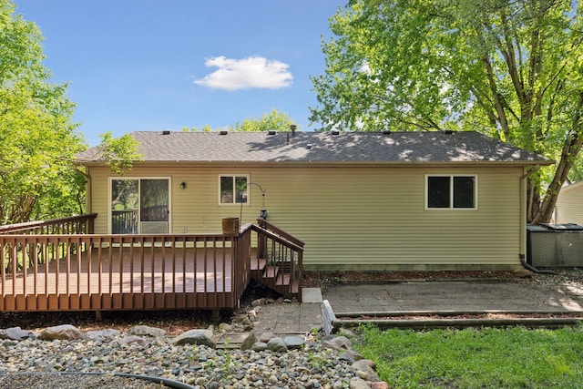 1604 Viking Dr, Buffalo, MN 55313 - back of property with a wooden deck and central AC