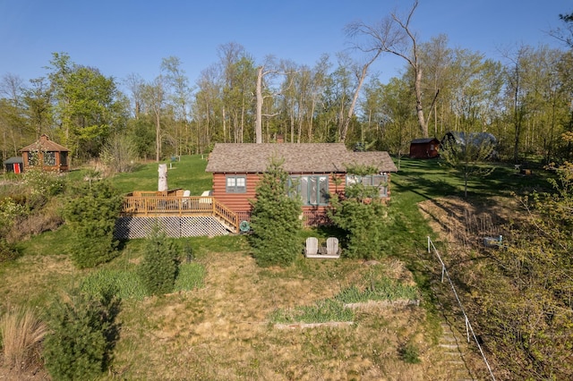 1949 Little Blake Lake Ln, Georgetown Twp, WI 54853 - view of front of home featuring a wooden deck and a front lawn