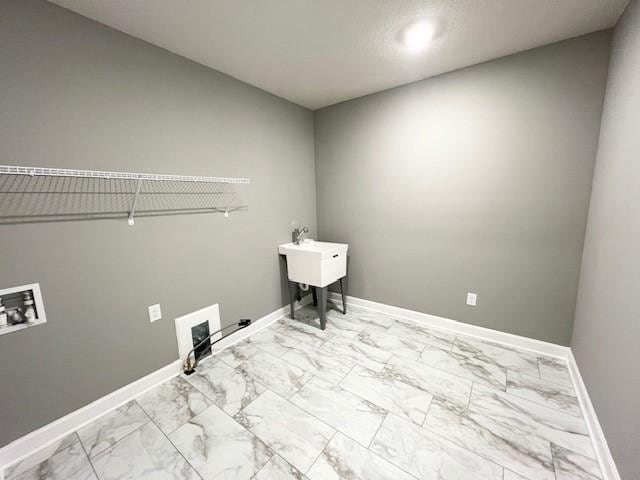 3112 Sugar Maple Dr, Chaska, MN 55318 - laundry area with marble look tiles, hookup for a gas dryer, hookup for a washing machine, baseboards, and recessed lighting