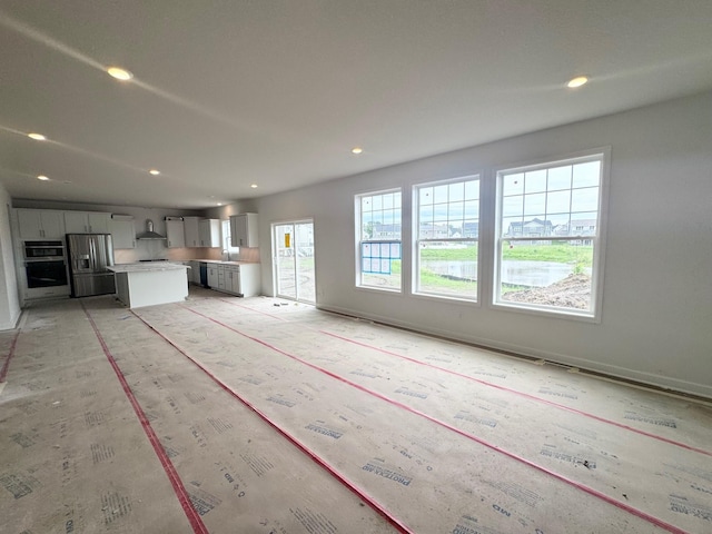 3112 Sugar Maple Dr, Chaska, MN 55318 - unfurnished living room with recessed lighting and a sink