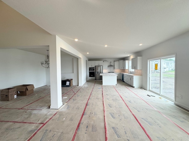 3112 Sugar Maple Dr, Chaska, MN 55318 - unfurnished living room featuring recessed lighting and a textured ceiling
