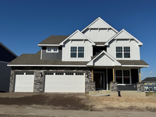 3112 Sugar Maple Dr, Chaska, MN 55318 - craftsman inspired home with a garage, board and batten siding, stone siding, covered porch, and driveway