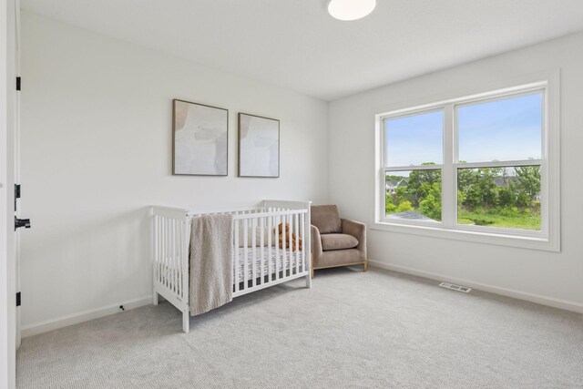 4612 Meadowview Ln, Minnetrista, MN 55331 - carpeted bedroom featuring baseboards and a nursery area