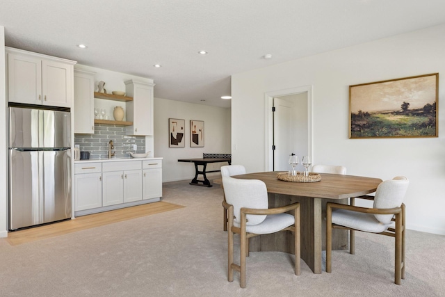 4612 Meadowview Ln, Minnetrista, MN 55331 - dining area with light colored carpet, recessed lighting, wet bar, and radiator