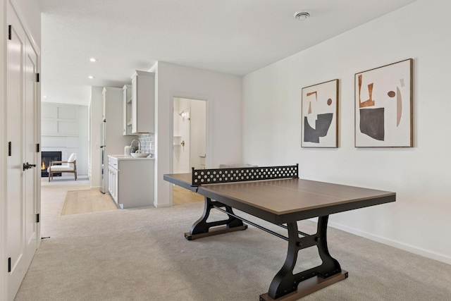 4612 Meadowview Ln, Minnetrista, MN 55331 - recreation room with light carpet, a fireplace, and recessed lighting