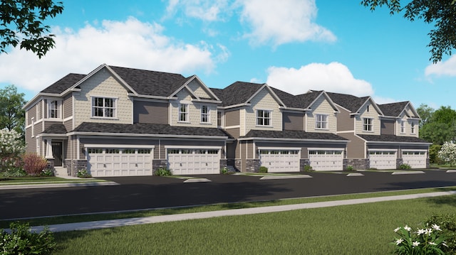 view of front of house featuring an attached garage, stone siding, a front lawn, and aphalt driveway