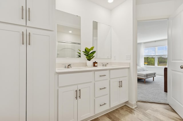 2146 Tyrone Dr, Shakopee, MN 55379 - full bath with double vanity, an enclosed shower, and recessed lighting
