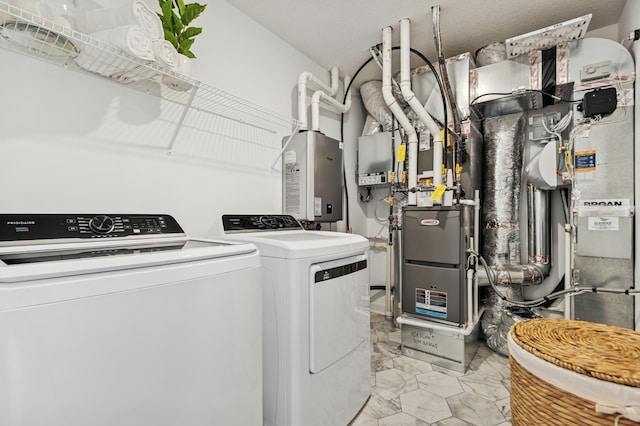 2146 Tyrone Dr, Shakopee, MN 55379 - laundry room featuring washing machine and dryer, light marble finish flooring, and water heater