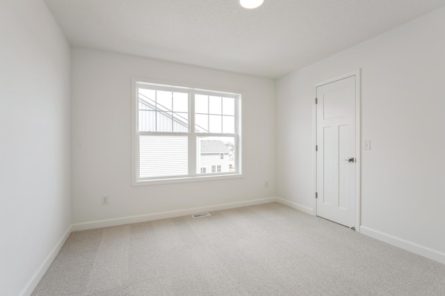 20092 67th Ave, Corcoran, MN 55340 - spare room with carpet floors and baseboards