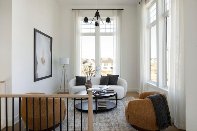 301 3rd St, Excelsior, MN 55331 - sitting room featuring a chandelier and baseboards