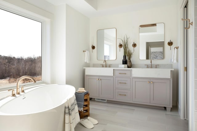 301 3rd St, Excelsior, MN 55331 - bathroom with double vanity and a soaking tub
