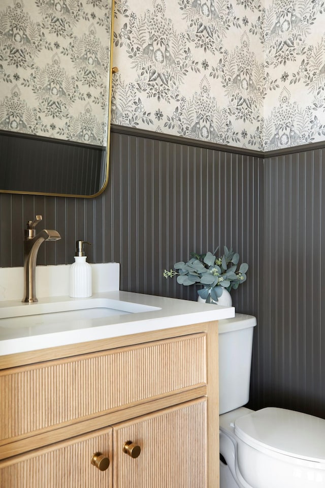 301 3rd St, Excelsior, MN 55331 - bathroom with wallpapered walls and vanity