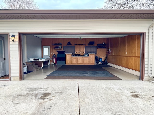1112 10th St, Gaylord, MN 55334 - garage featuring driveway and baseboard heating