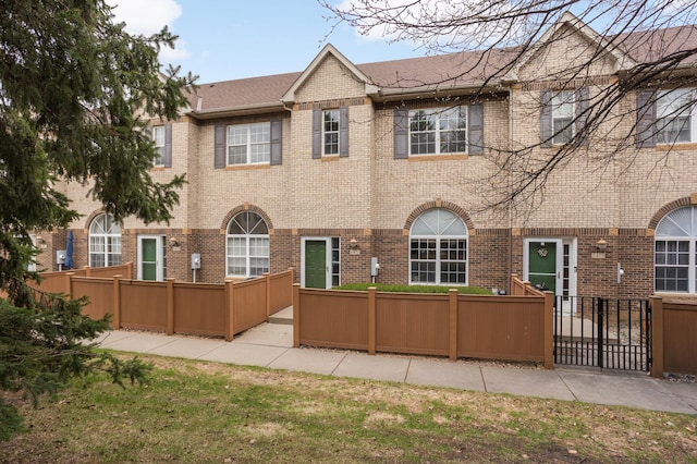 6477 Regency Ln, Eden Prairie, MN 55344 - rear view of house featuring brick siding and roof with shingles