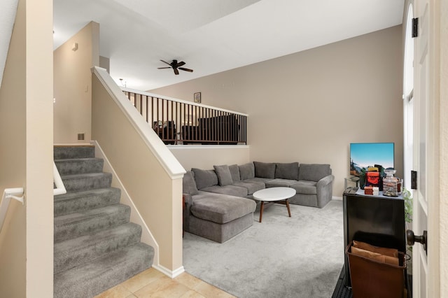 6477 Regency Ln, Eden Prairie, MN 55344 - carpeted living area featuring ceiling fan, stairs, baseboards, and tile patterned flooring