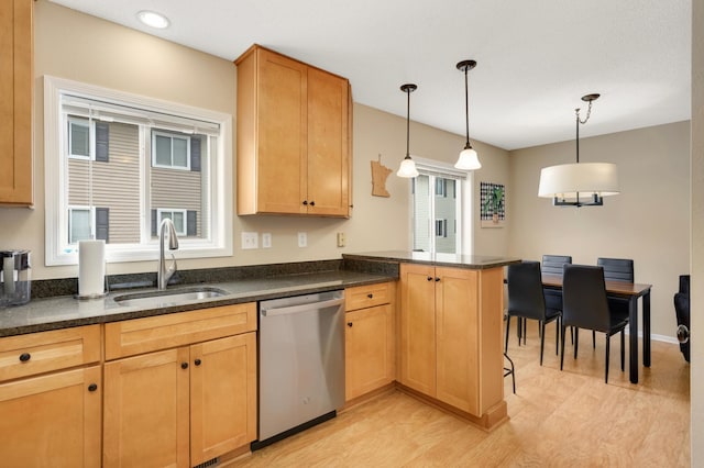 6477 Regency Ln, Eden Prairie, MN 55344 - kitchen with dishwasher, a sink, light wood-style flooring, a peninsula, and pendant lighting