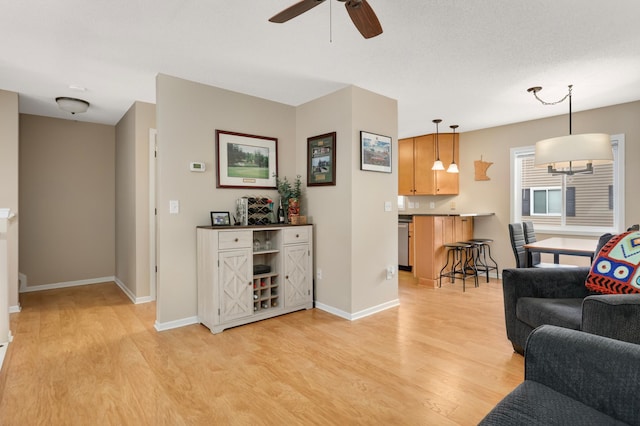 6477 Regency Ln, Eden Prairie, MN 55344 - living room with light wood-style floors, a ceiling fan, and baseboards
