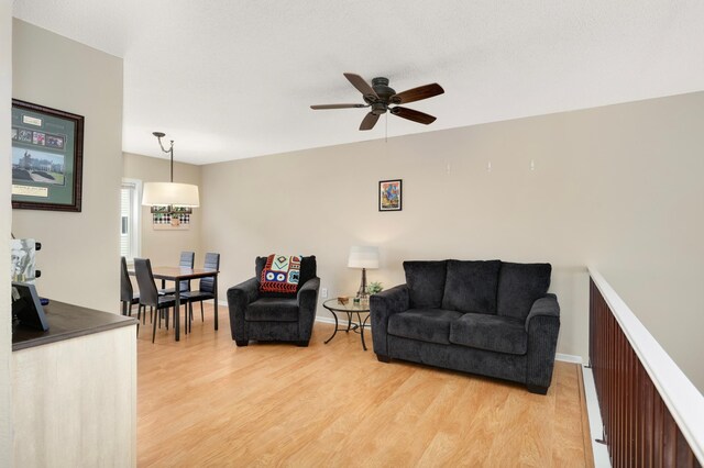 6477 Regency Ln, Eden Prairie, MN 55344 - living area with light wood-type flooring and a ceiling fan