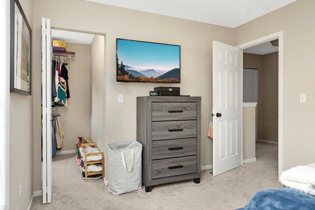 6477 Regency Ln, Eden Prairie, MN 55344 - carpeted bedroom with a spacious closet, a closet, and baseboards