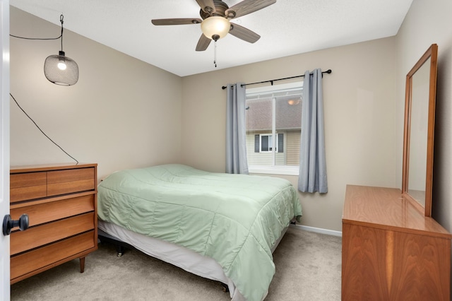 6477 Regency Ln, Eden Prairie, MN 55344 - carpeted bedroom with baseboards and a ceiling fan