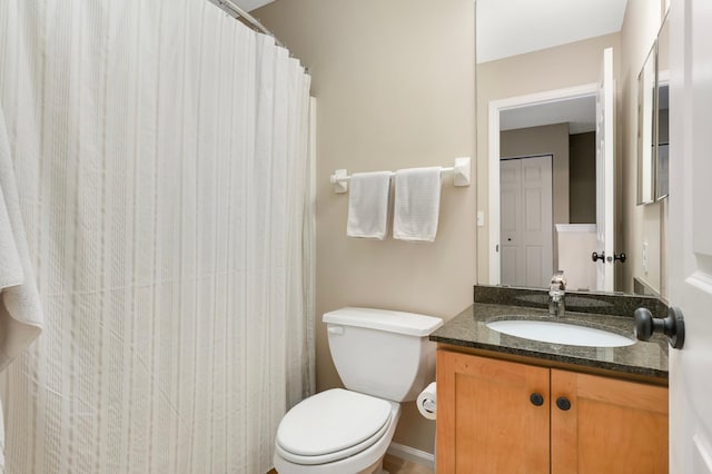 6477 Regency Ln, Eden Prairie, MN 55344 - bathroom featuring toilet, vanity, and curtained shower