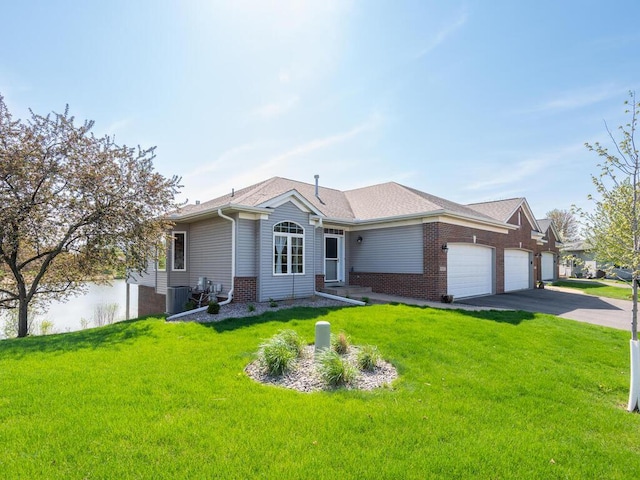 single story home featuring an attached garage, central air condition unit, a front lawn, asphalt driveway, and brick siding